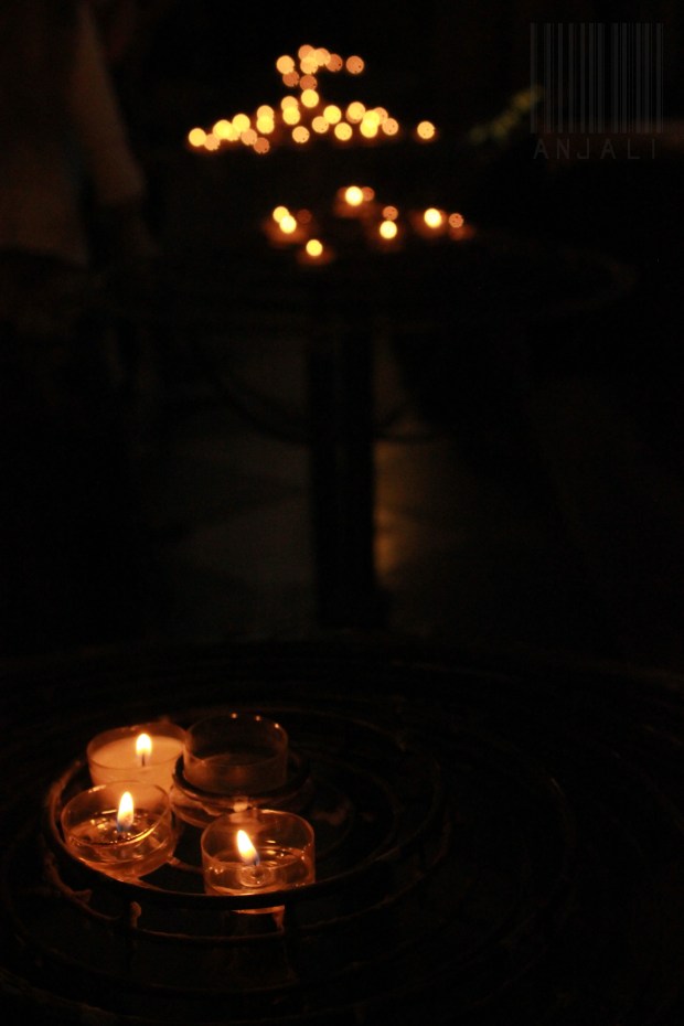 the little lamps that lit the dark church aisle